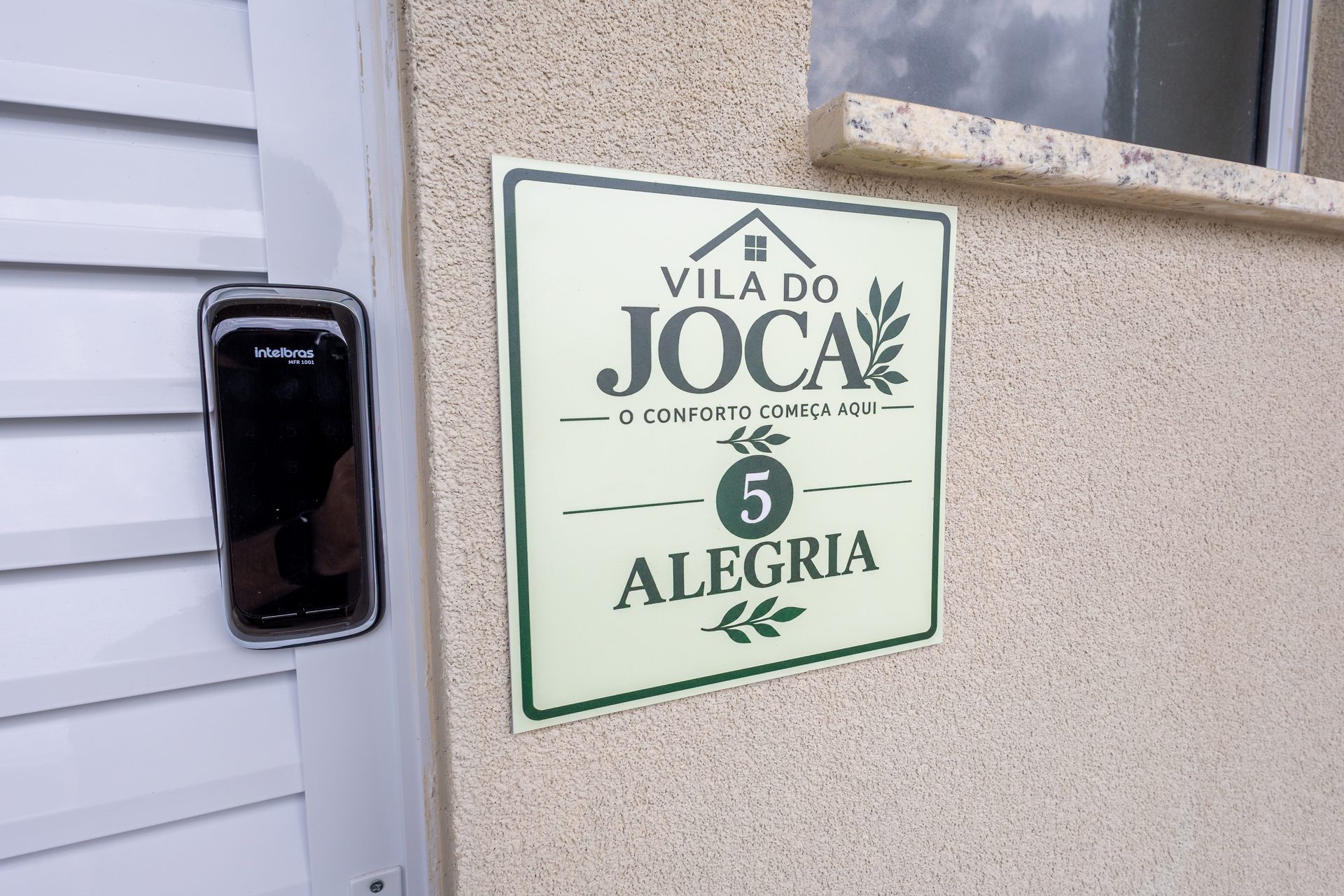 Placa do apartamento Alegria