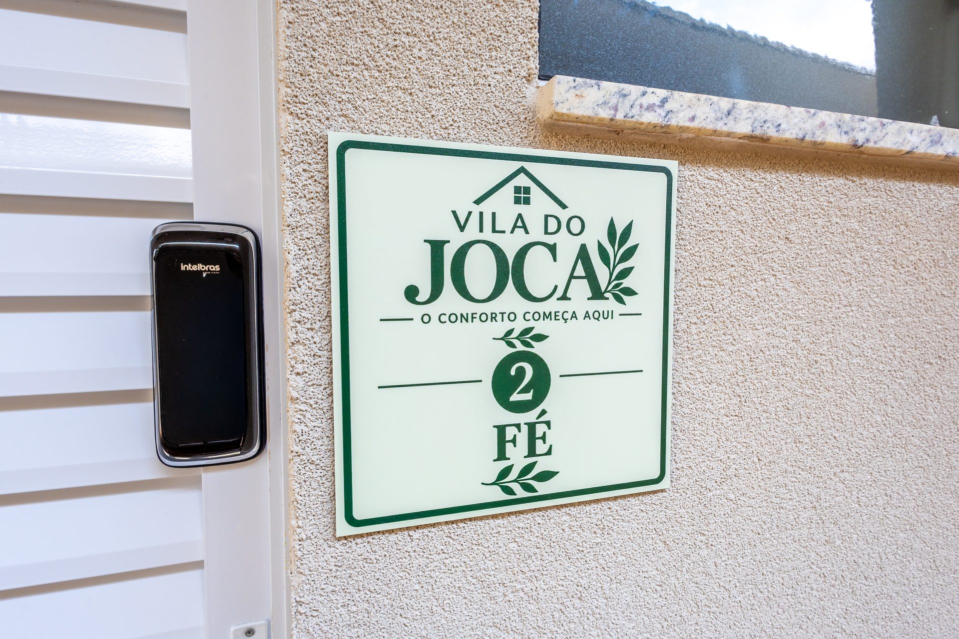 Placa do apartamento Fé